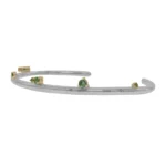 Silver Lining Cuff by Philadelphia’s Emily Chelsea Jewelry, featuring Indian moss agate, Nigerian green tourmaline, and a polished finish symbolizing optimism.