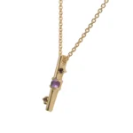 Through It All Necklace by Philadelphia’s Emily Chelsea Jewelry, featuring amethyst, spinel, and a symbolic interrupted bar motif.