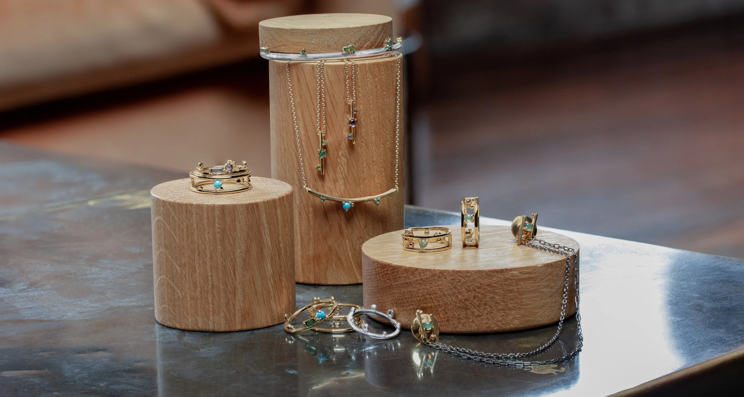 Jewelry display collection featuring gemstones symbolizing milestones and strength, custom-designed by local jeweler Emily Chelsea Jewelry in Philadelphia.