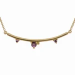 The Arc Necklace from Emily Chelsea Jewelry features Uruguayan amethyst and Tanzanian lavender spinel. A perfect staple from the Space and Time collection.