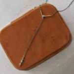 Plunge Necklace by local jeweler, featuring turquoise cabochons and teal tourmaline in a lariat style, set on an adjustable recycled sterling silver chain.