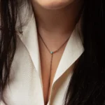 Plunge Necklace by Philadelphia local jeweler Emily Chelsea Jewelry, featuring turquoise, teal tourmaline, and recycled sterling silver in a lariat style.