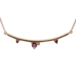 The Arc Necklace from Emily Chelsea Jewelry features Uruguayan amethyst and Tanzanian lavender spinel. A perfect staple from the Space and Time collection.