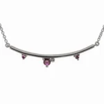 The Arc Necklace from Emily Chelsea Jewelry features Uruguayan amethyst and Tanzanian lavender spinel. A perfect staple from the Space and Time collection.