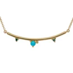 The Arc Necklace by Emily Chelsea Jewelry features Arizonian turquoise and Nigerian teal tourmaline. A perfect staple piece from the Space and Time collection.