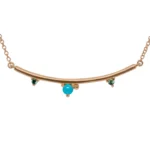 The Arc Necklace by Emily Chelsea Jewelry features Arizonian turquoise and Nigerian teal tourmaline. A perfect staple piece from the Space and Time collection.