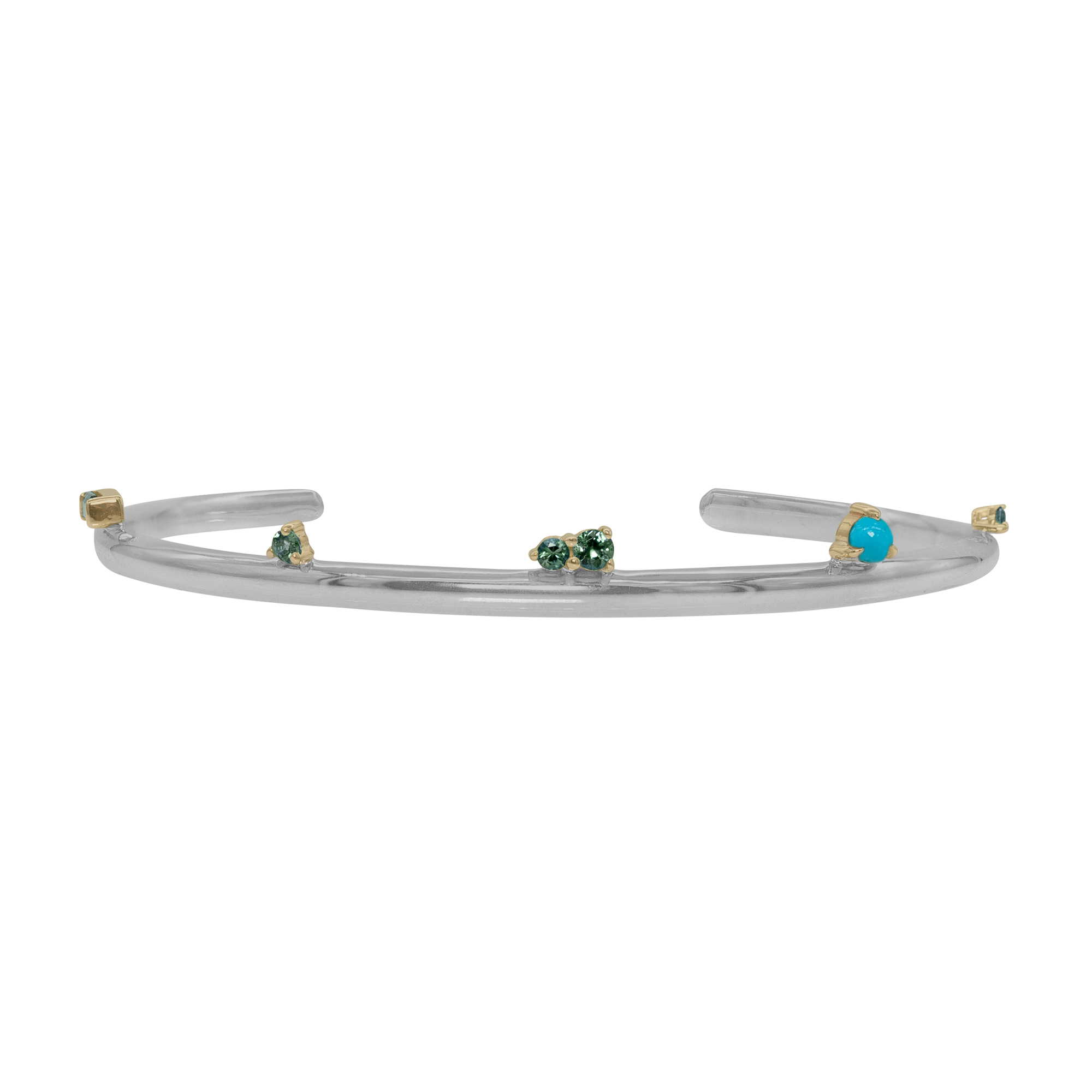 The Silver Lining Cuff from Emily Chelsea Jewelry features Arizonian turquoise, Nigerian teal tourmaline, and a polished finish. A perfect piece to add to your stack.