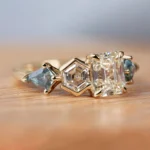 Custom Toi et Moi ring by Philadelphia's Emily Chelsea Jewelry with recycled diamonds, teal sapphires, and 14kt yellow gold.