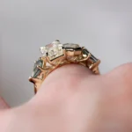 Custom Toi et Moi ring by Philadelphia's Emily Chelsea Jewelry with recycled diamonds, teal sapphires, and 14kt yellow gold.