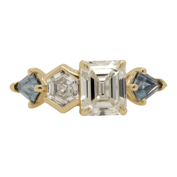 Custom Toi et Moi ring by Philadelphia's Emily Chelsea Jewelry with recycled diamonds, teal sapphires, and 14kt yellow gold.